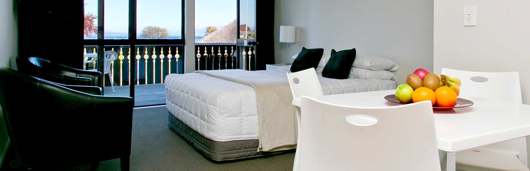 SWISS COTTAGE STYLE MOTEL APARTMENTS IN NEW ZEALAND’S LAKE TAUPO WATERFRONT